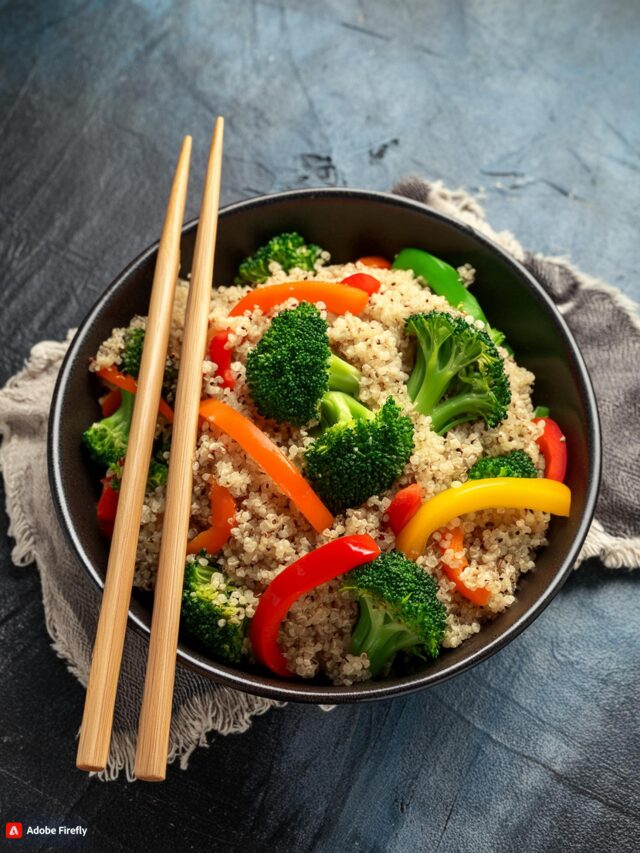 Firefly A bowl of quinoa stir-fry with vibrant vegetables like bell peppers, broccoli, and carrots.